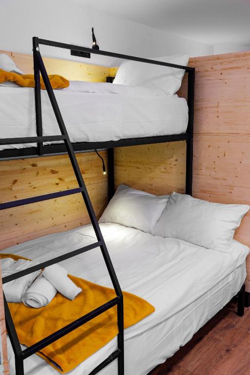 Letto o letti in una camera di Hydeout Bakuriani