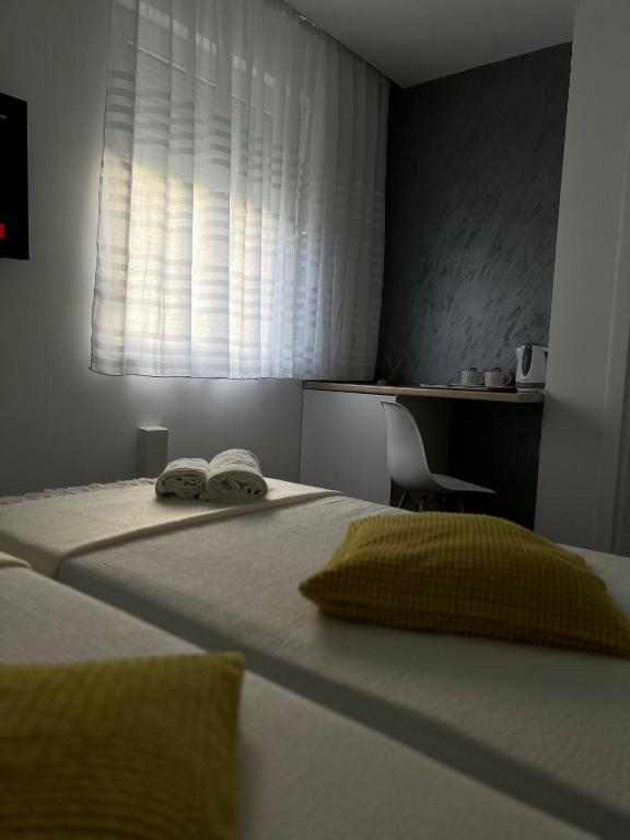 Postel nebo postele na pokoji v ubytování Villa Symphony