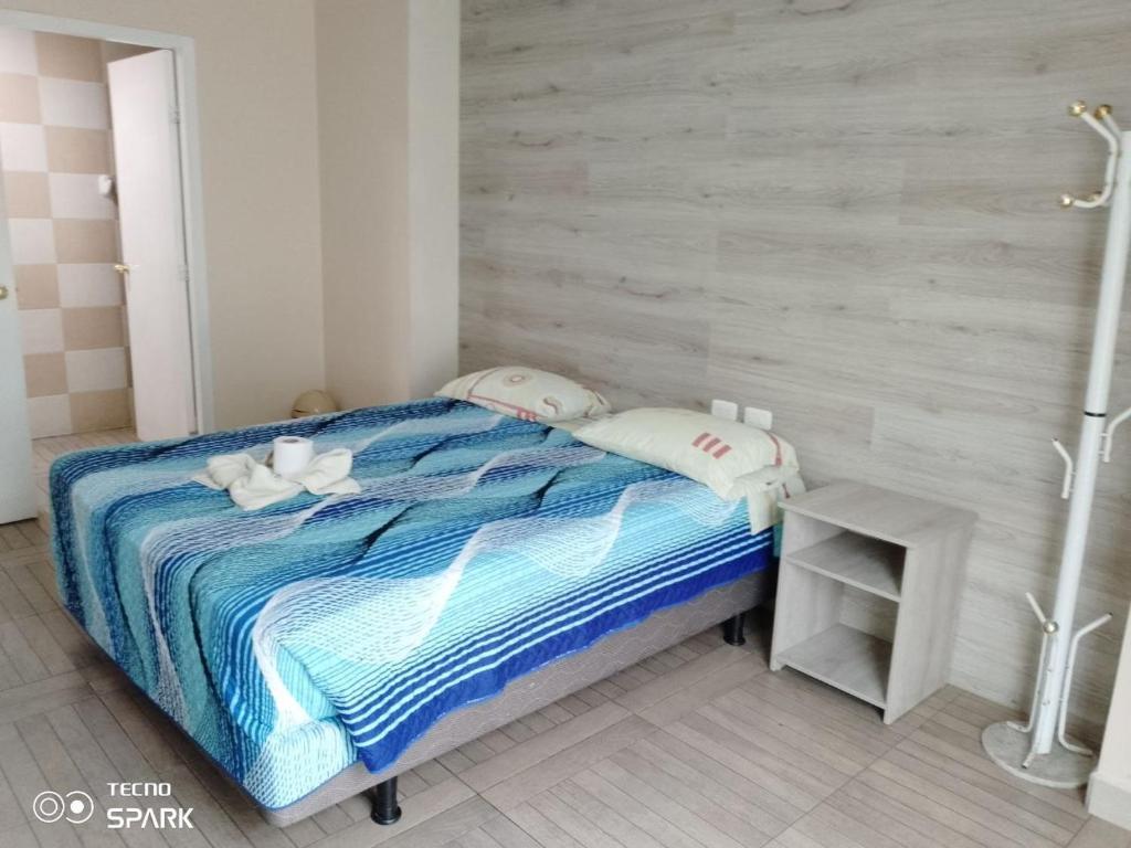 Postel nebo postele na pokoji v ubytování HOSPEDAJE YACUCALLE