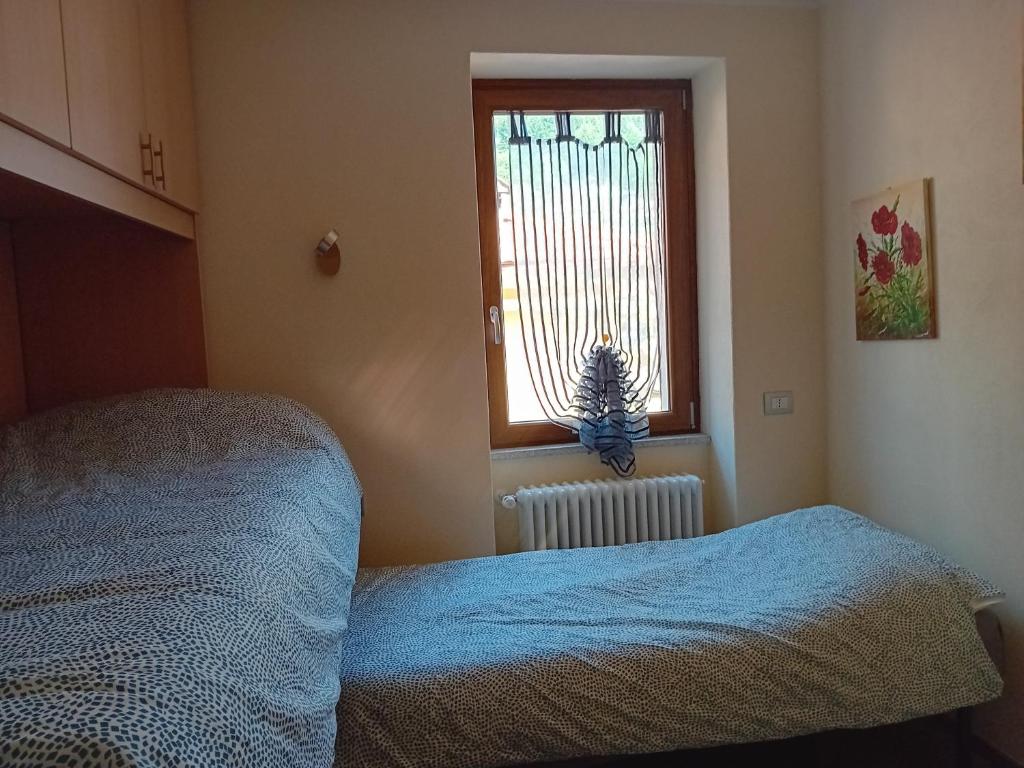 Postel nebo postele na pokoji v ubytování Casa di Ariel