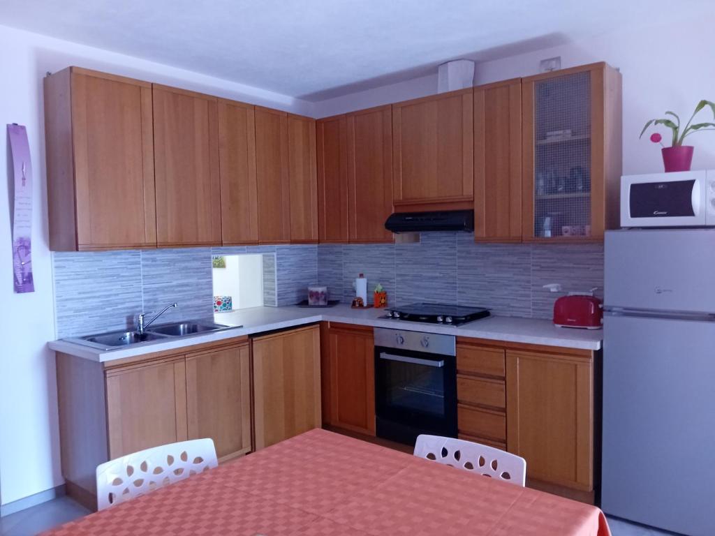 Kuchyň nebo kuchyňský kout v ubytování Casa di Ariel