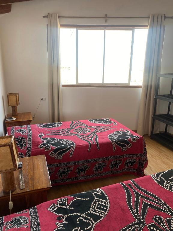 Postel nebo postele na pokoji v ubytování Buena Vista Lobitos