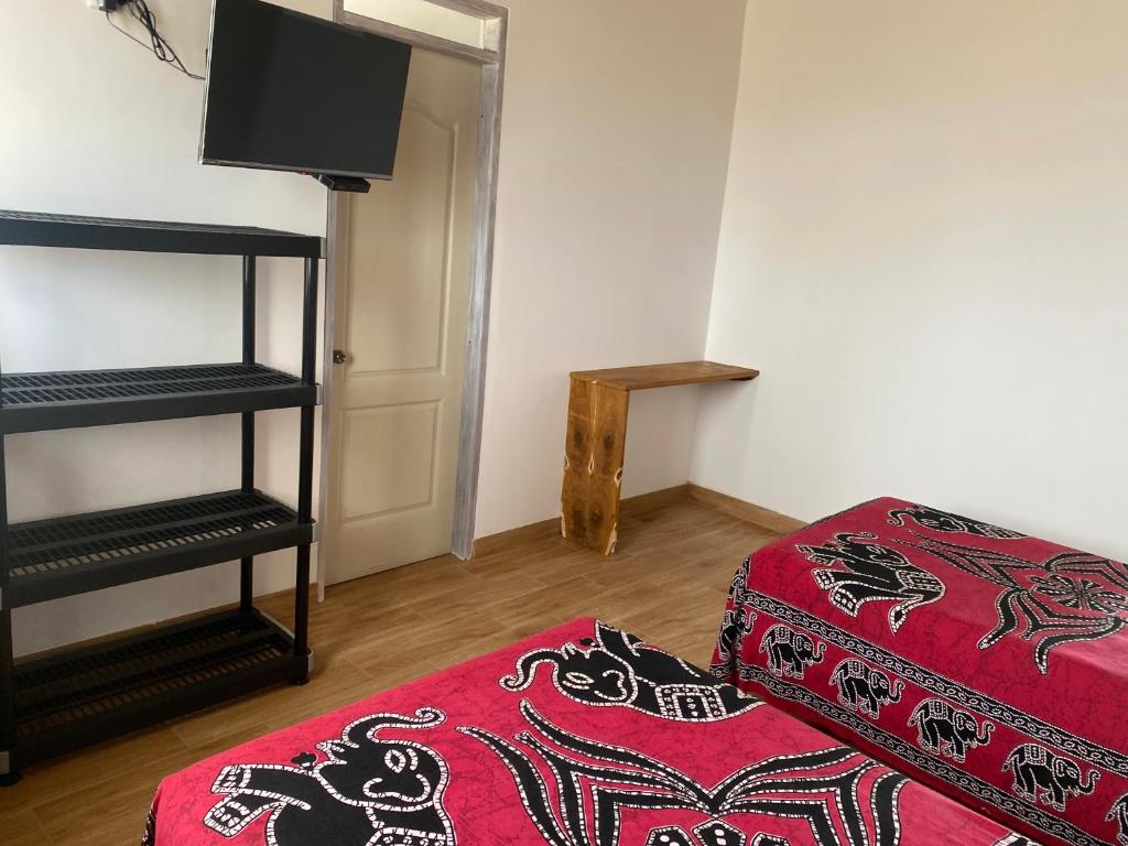 Postel nebo postele na pokoji v ubytování Buena Vista Lobitos