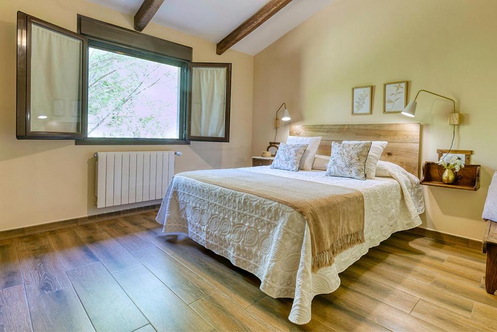 Łóżko lub łóżka w pokoju w obiekcie Apartamentos rurales Alameda del Jerte