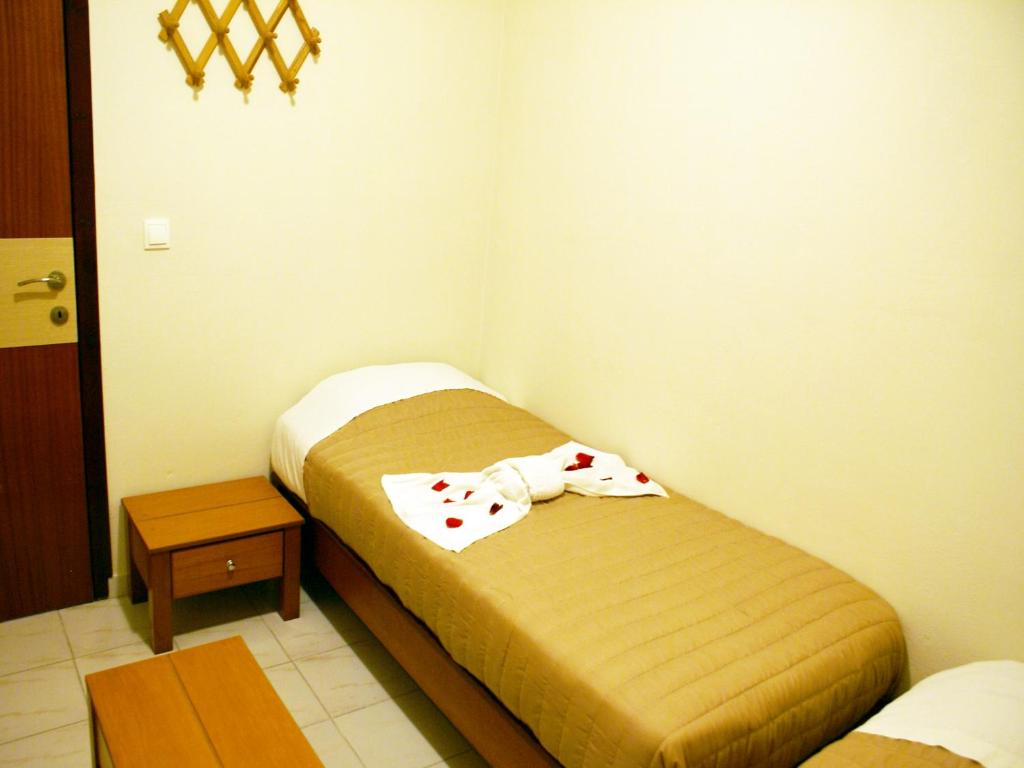 Postel nebo postele na pokoji v ubytování Golden Sun