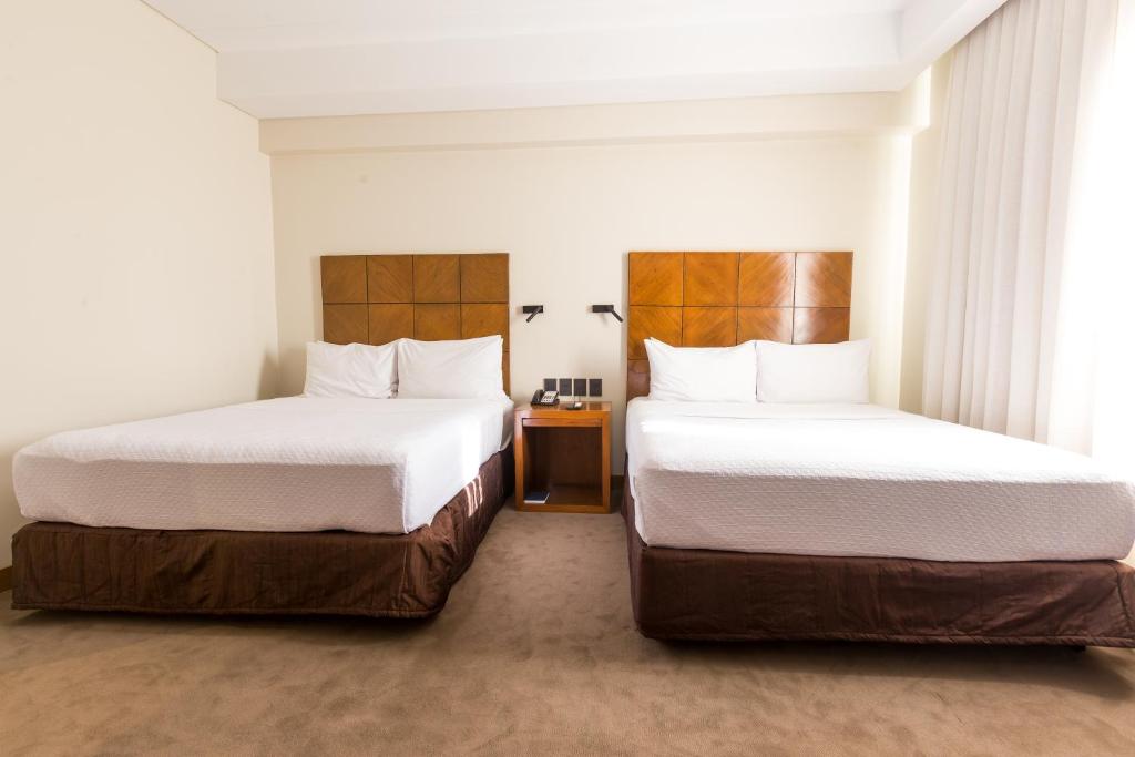 Postel nebo postele na pokoji v ubytování Crowne Plaza Asunción by IHG