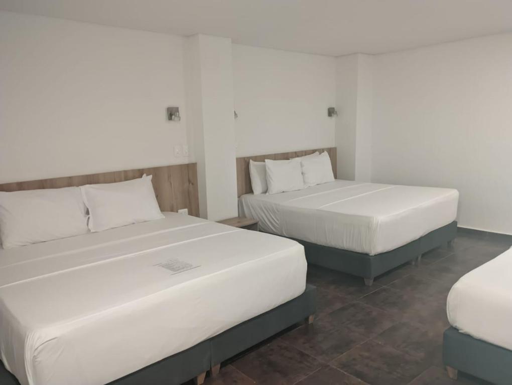 Postel nebo postele na pokoji v ubytování Hotel Caribbean Cartagena