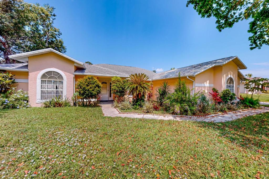 a home with a large yard at Palm Bay Getaway in Palm Bay