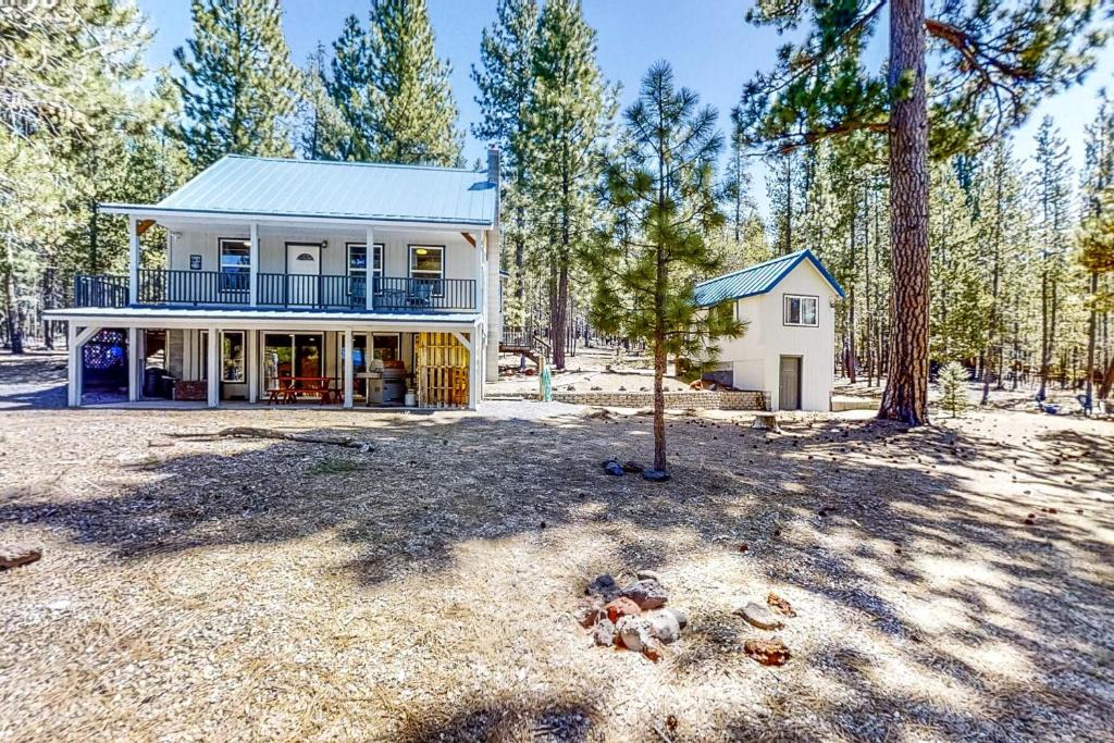 a house in the middle of a forest at Hibernation Station at Big Pine Retreat in Crescent