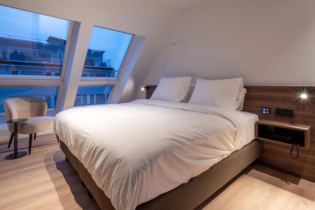 Postel nebo postele na pokoji v ubytování ONE TWO FOUR - Hotel & Spa
