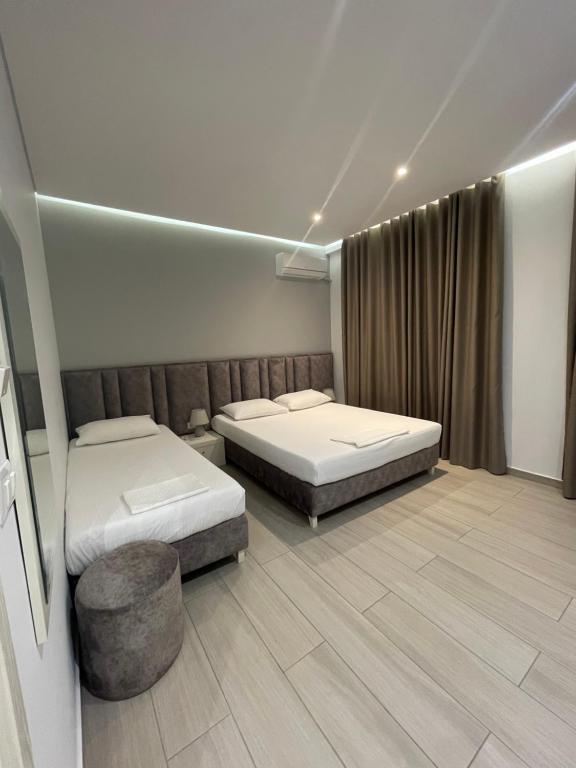 Postel nebo postele na pokoji v ubytování Hotel LIDI