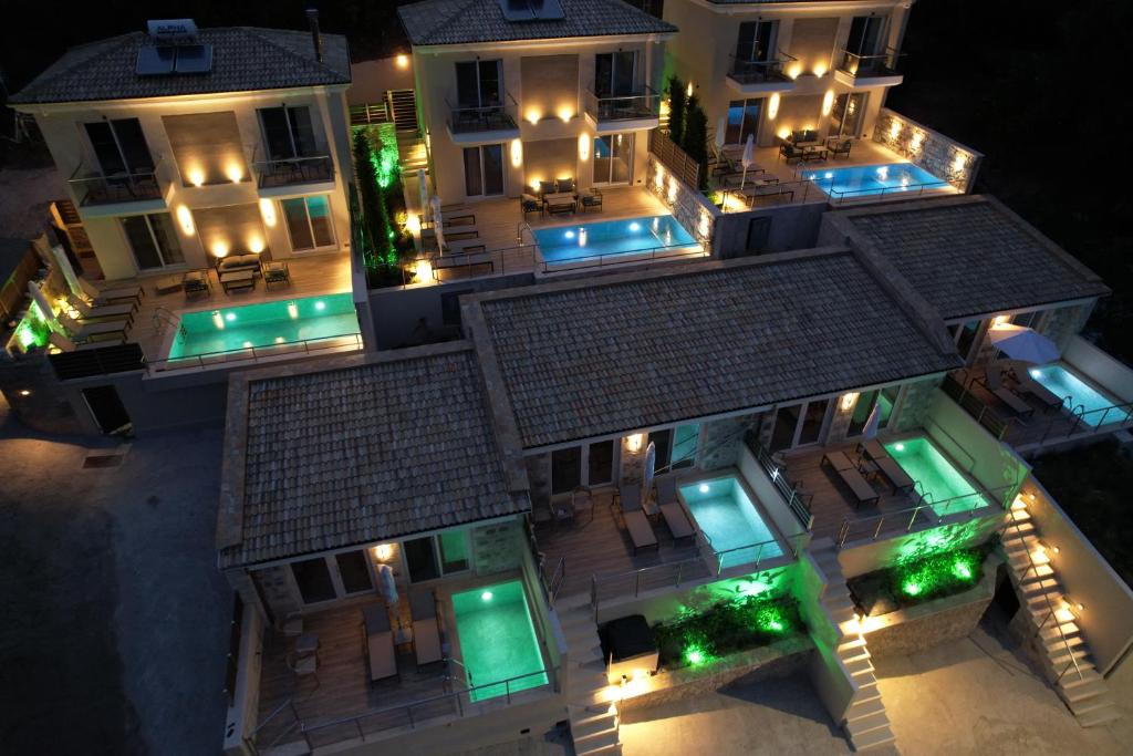 an aerial view of a house at night with lights at Elais Luxury Villas in Parga