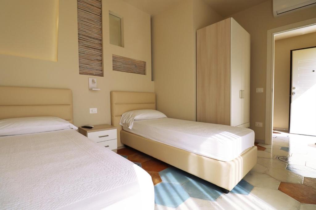 Postel nebo postele na pokoji v ubytování Borgo San Cosmo Tropea
