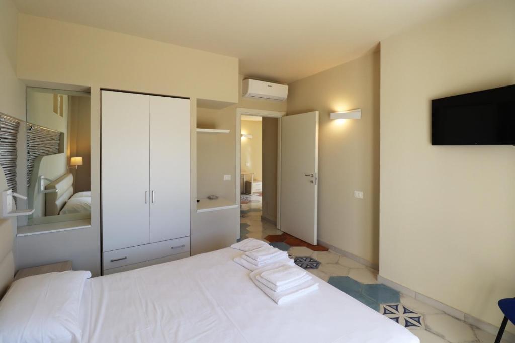Postel nebo postele na pokoji v ubytování Borgo San Cosmo Tropea