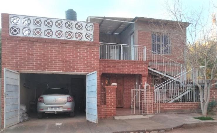 a car is parked inside of a brick house at Departamentos Martínez - Páez in Villa Unión