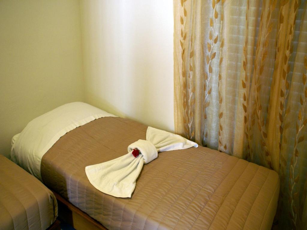 Postel nebo postele na pokoji v ubytování Golden Sun