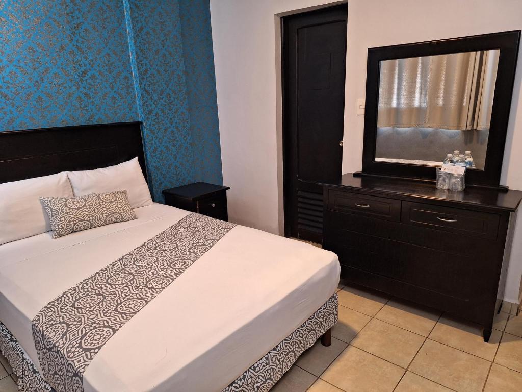 Postel nebo postele na pokoji v ubytování Hotel Costa Verde