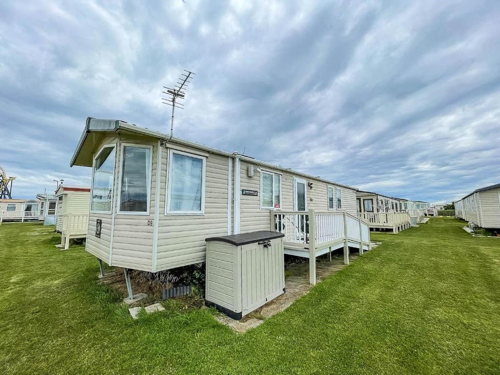 a row of mobile homes in a field of grass at Modern 6 Berth Caravan For Hire At Fantasy Island In Skegness Ref 58009d in Skegness