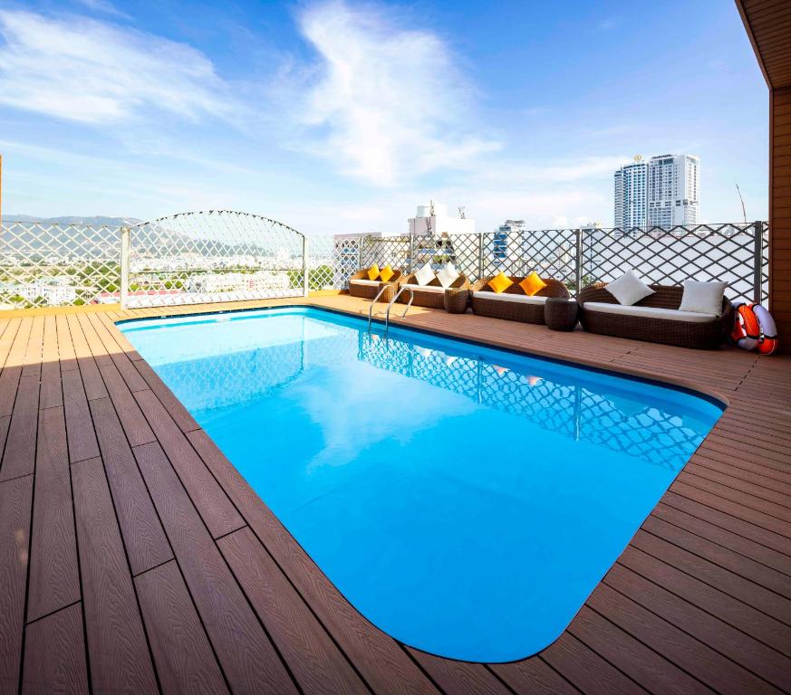 a swimming pool on top of a building at Navy Hotel Nha Trang in Nha Trang