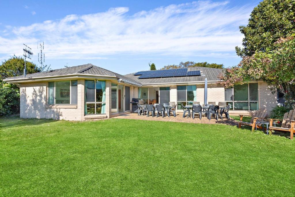 a house with a lawn in front of it at Bella Vista in Gerringong