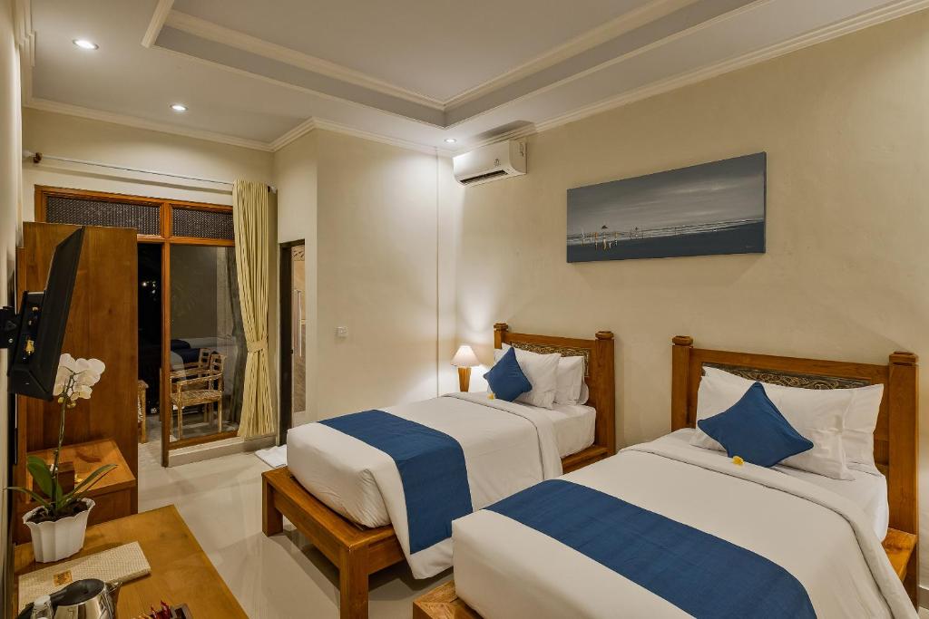Postel nebo postele na pokoji v ubytování Tigata Ubud Cottage