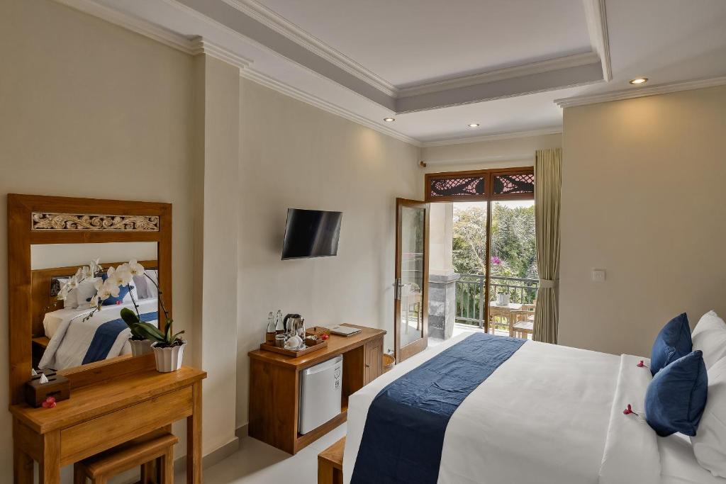 Postel nebo postele na pokoji v ubytování Tigata Ubud Cottage