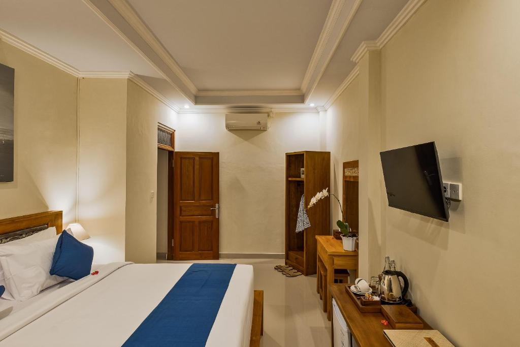 TV a/nebo společenská místnost v ubytování Tigata Ubud Cottage