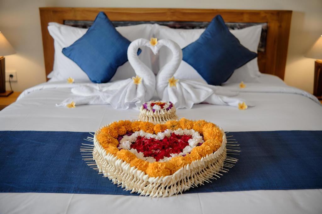 Postel nebo postele na pokoji v ubytování Tigata Ubud Cottage