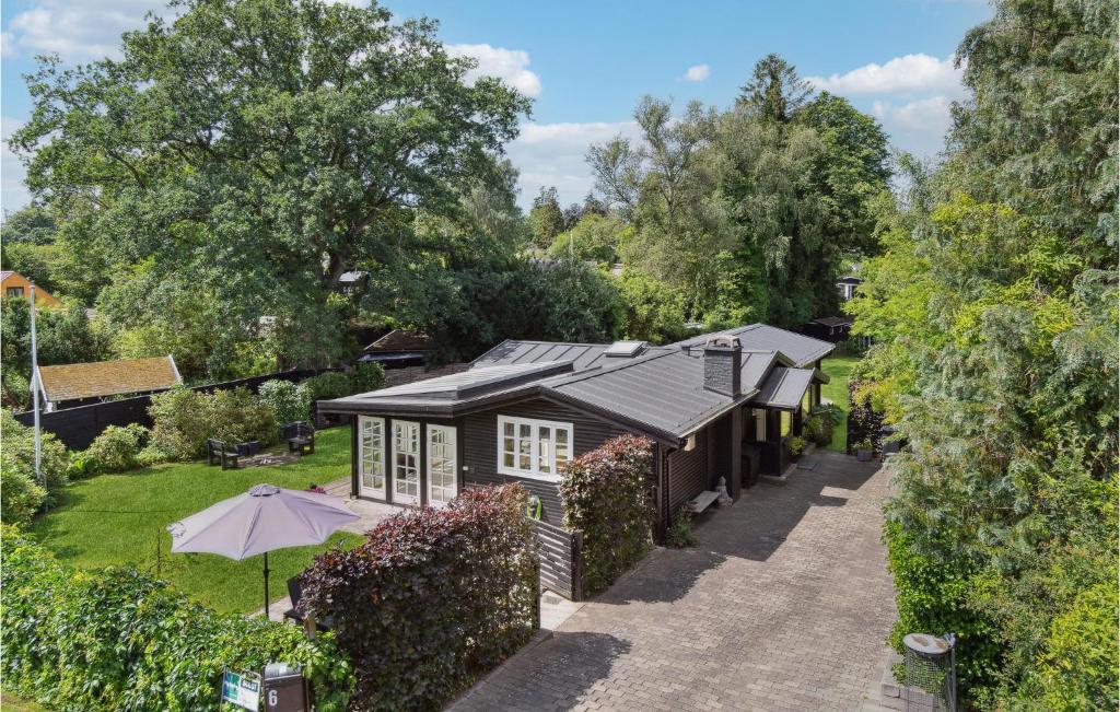 an overhead view of a house with an umbrella at Amazing Home In Hornbk With Wifi in Hornbæk