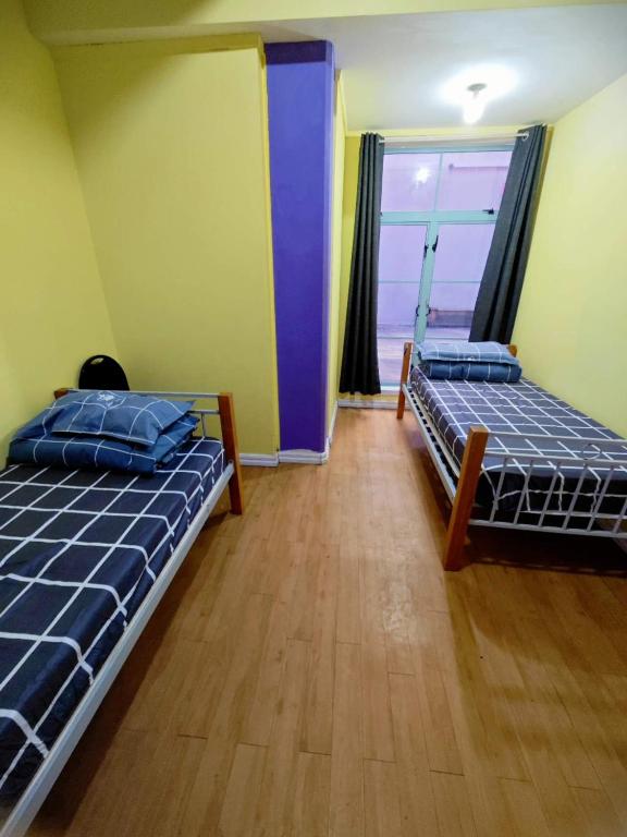 Postel nebo postele na pokoji v ubytování Frienz Backpacker