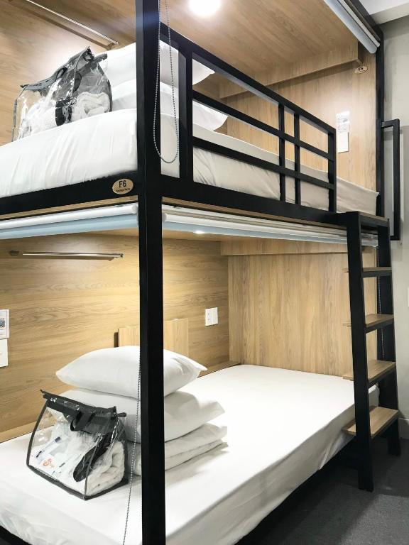 Postel nebo postele na pokoji v ubytování Amango Dorm