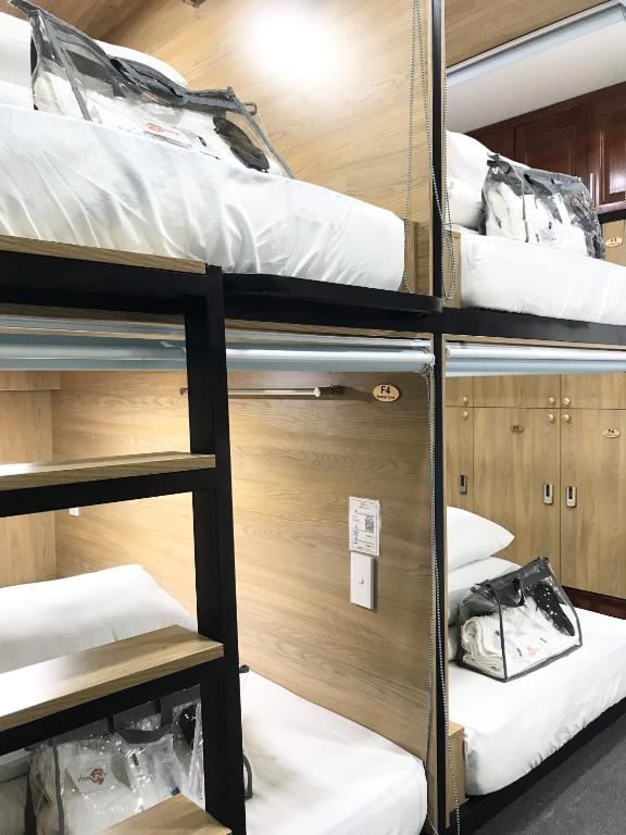 Postel nebo postele na pokoji v ubytování Amango Dorm