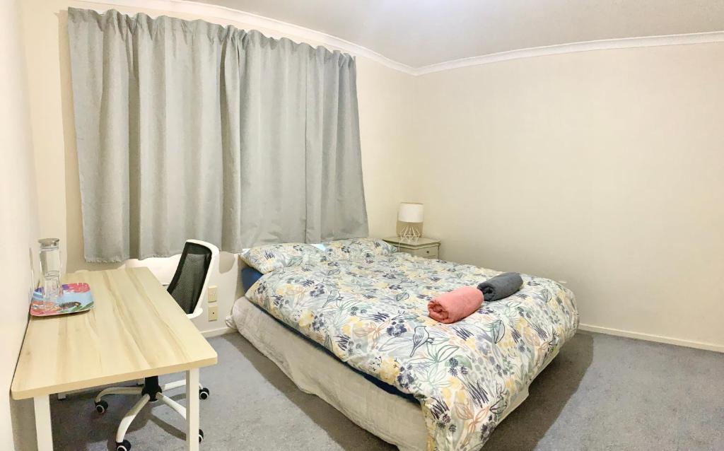 Postel nebo postele na pokoji v ubytování Radiata Homestay