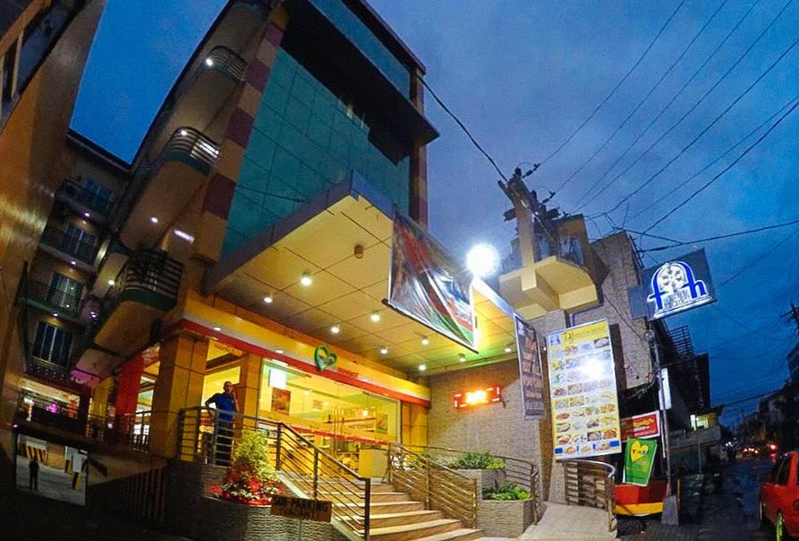 a store front of a building at night at RedDoorz Plus @ Taj Hotel Tuguegarao in Tuguegarao City