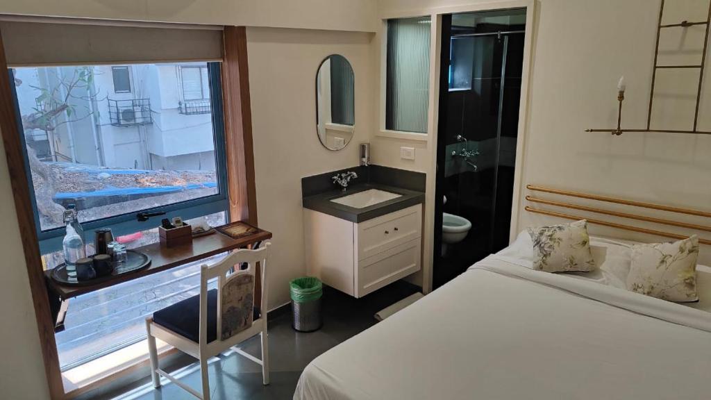 Postel nebo postele na pokoji v ubytování Hotel Kemps Corner