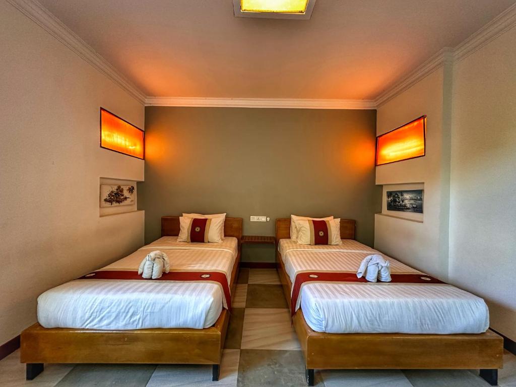 Postel nebo postele na pokoji v ubytování Villa Um Theara, Siem Reap
