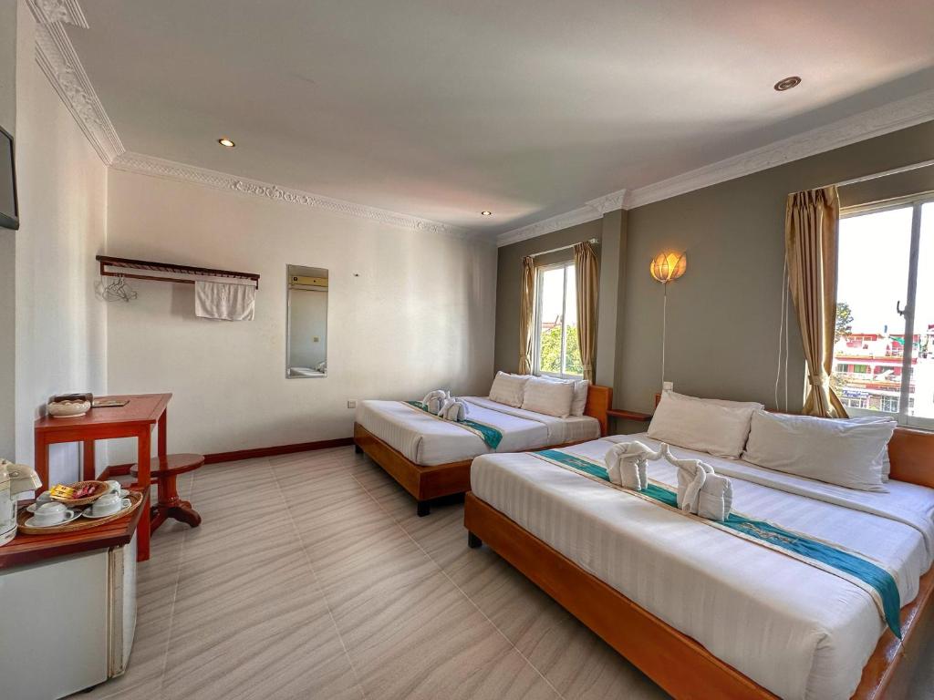 Postel nebo postele na pokoji v ubytování Villa Um Theara, Siem Reap