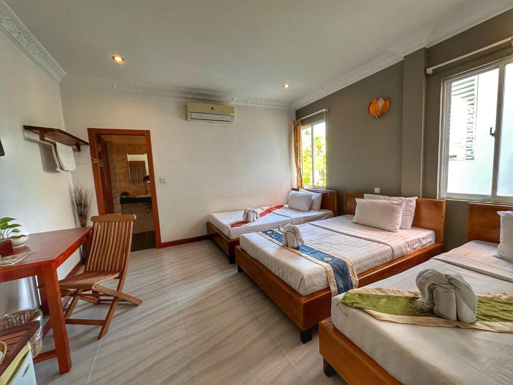Postel nebo postele na pokoji v ubytování Villa Um Theara, Siem Reap