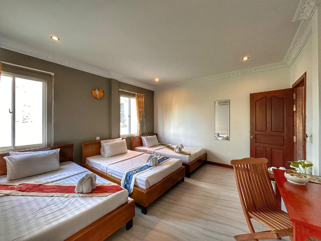 Postel nebo postele na pokoji v ubytování Villa Um Theara, Siem Reap