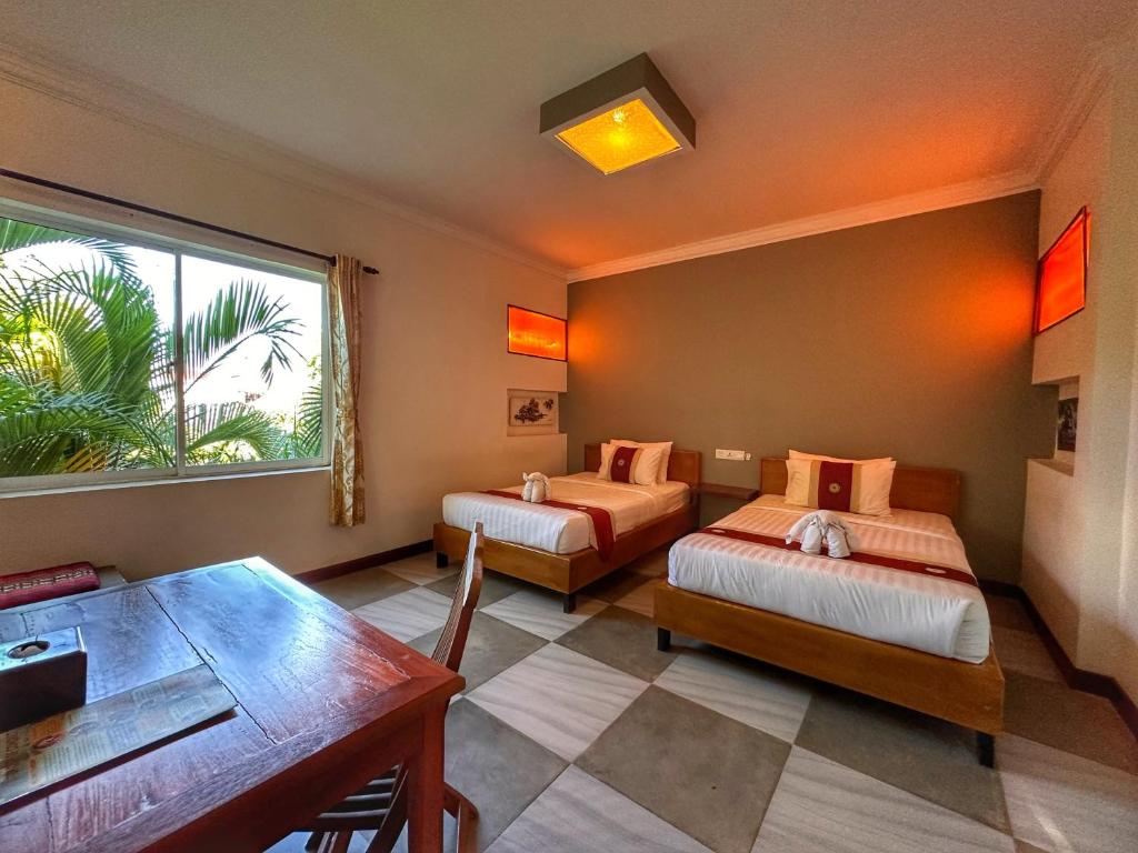 Postel nebo postele na pokoji v ubytování Villa Um Theara, Siem Reap