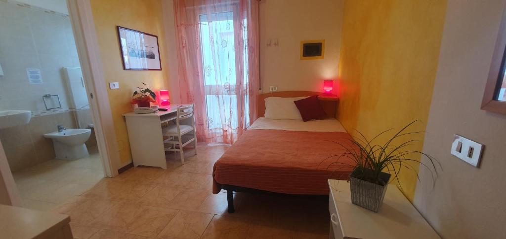 Postel nebo postele na pokoji v ubytování Hotel Nuova Graziosa