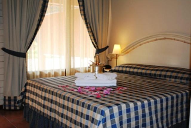 Postel nebo postele na pokoji v ubytování Motel 7 Laghi