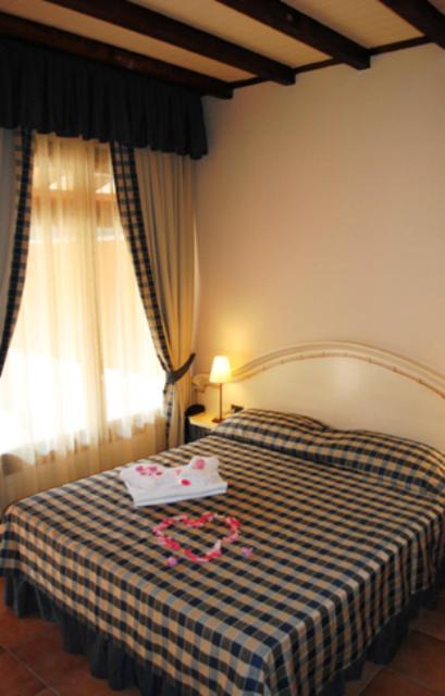 Postel nebo postele na pokoji v ubytování Motel 7 Laghi