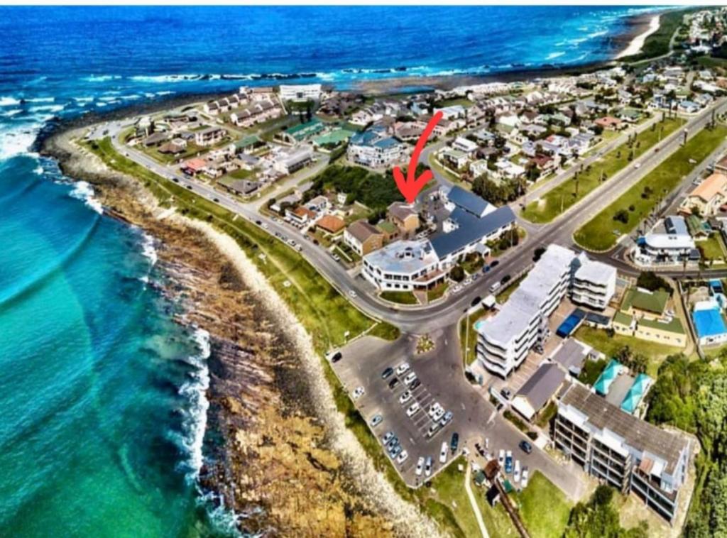 an aerial view of a resort next to the ocean at 6 Bayview in East London