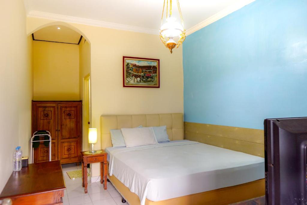 Ένα ή περισσότερα κρεβάτια σε δωμάτιο στο Hotel Tulips