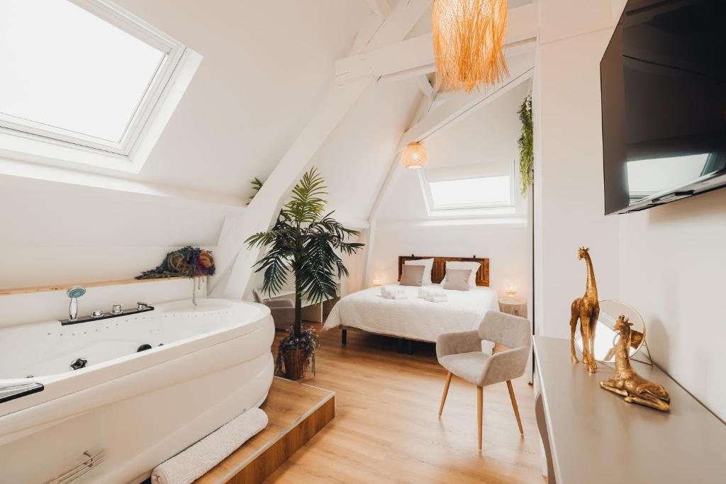 Postel nebo postele na pokoji v ubytování AU COIN DE PARADIS - Suite balnéo