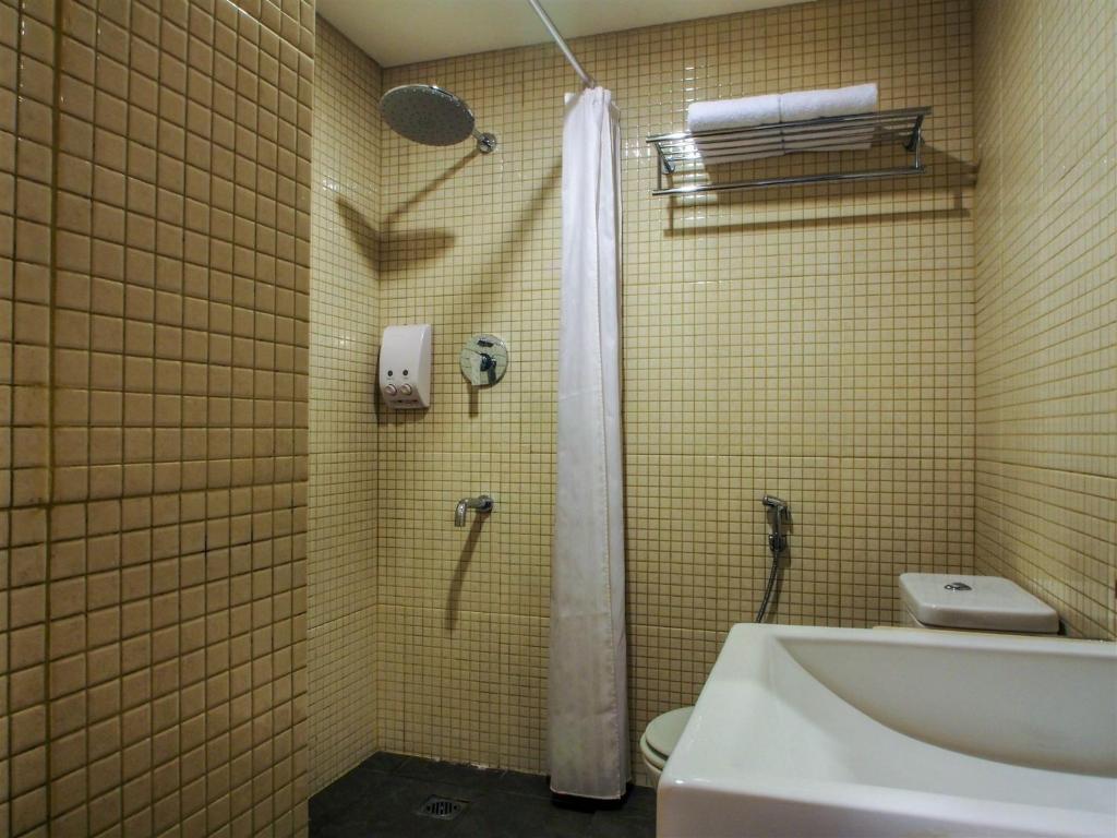 Koupelna v ubytování M Hotel