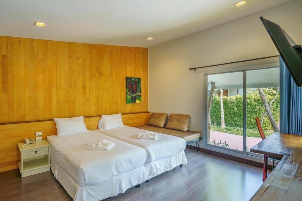 Ein Bett oder Betten in einem Zimmer der Unterkunft IP Plus Pool Villa Pattaya