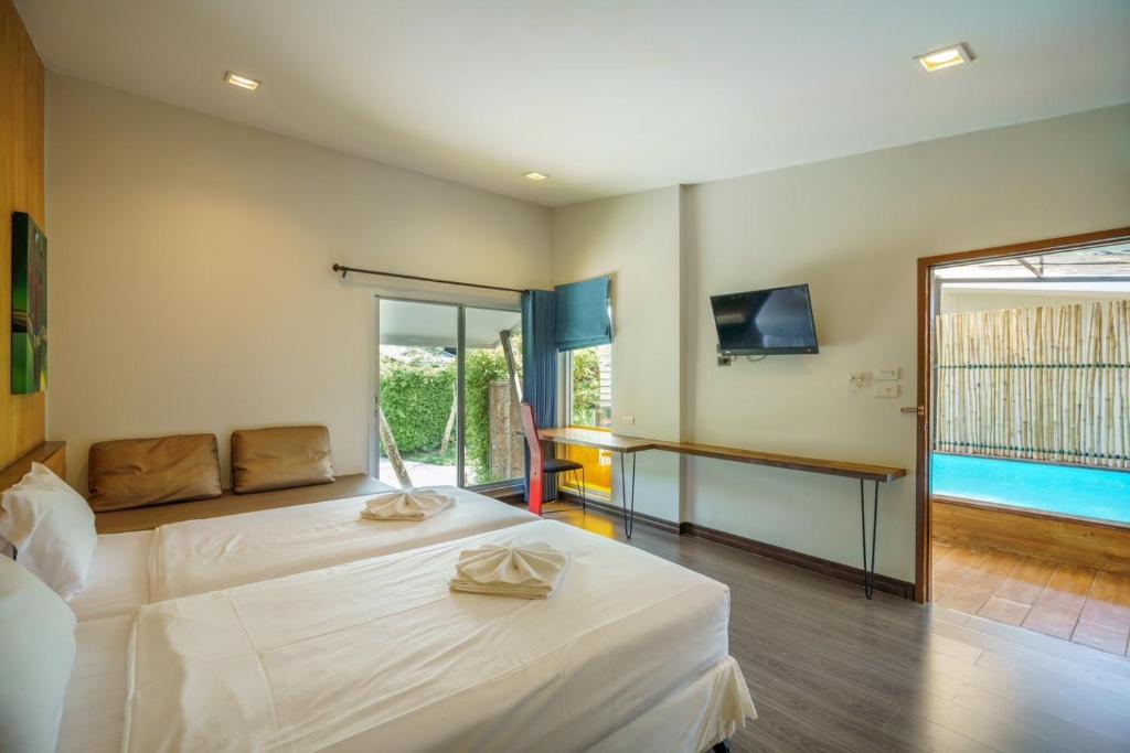 Ein Bett oder Betten in einem Zimmer der Unterkunft IP Plus Pool Villa Pattaya