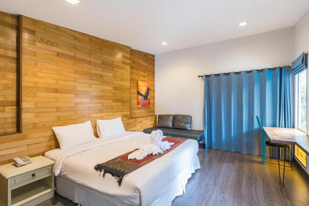Ein Bett oder Betten in einem Zimmer der Unterkunft IP Plus Pool Villa Pattaya